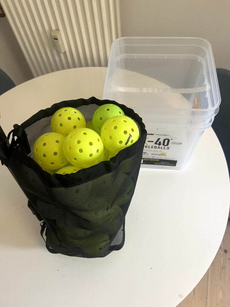 Retrora pickleball retriever basket holding Franklin X-40 pickleballs
