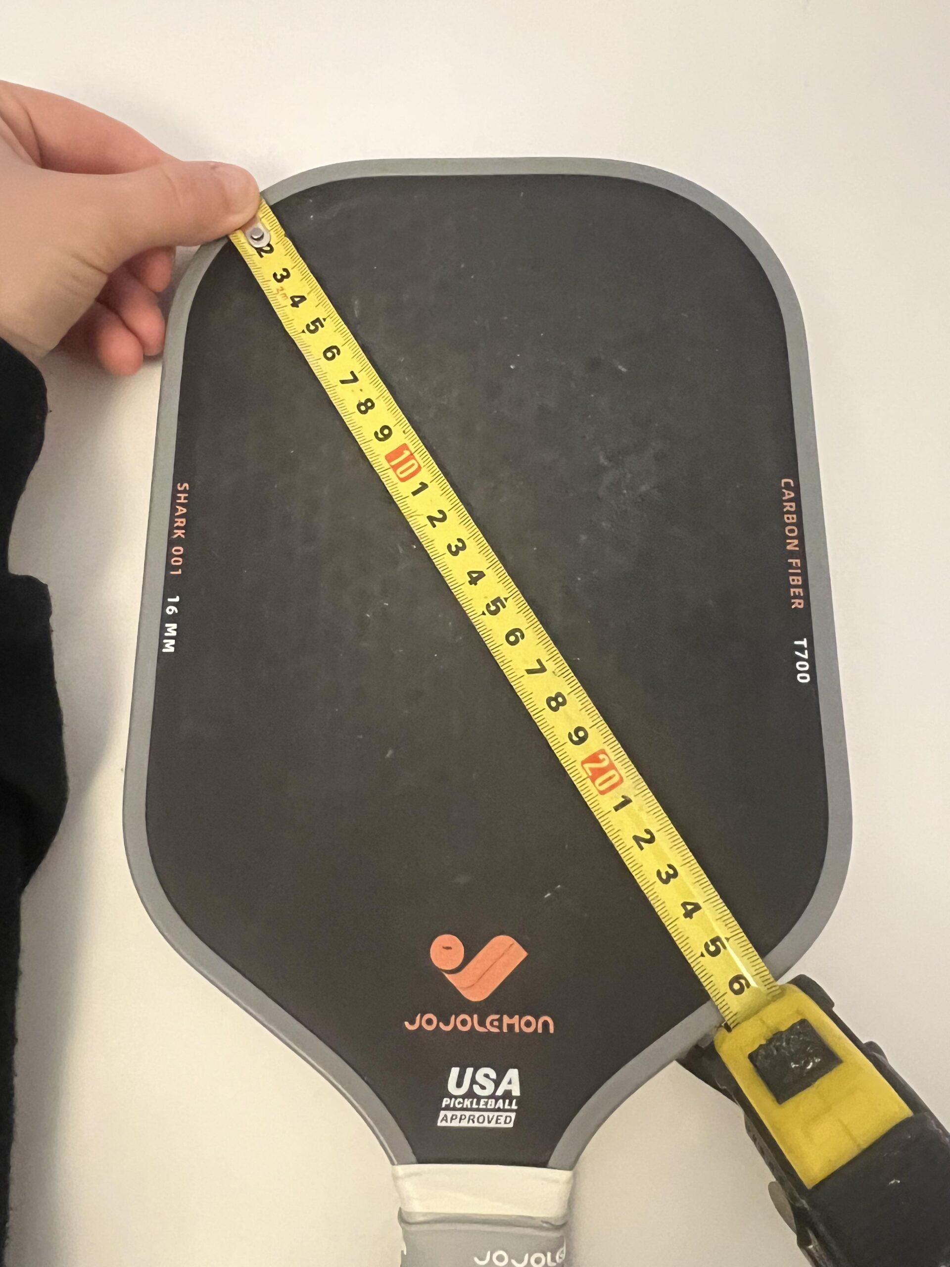 JOJOLEMON Shark 100 paddle face measured with a tape measure
