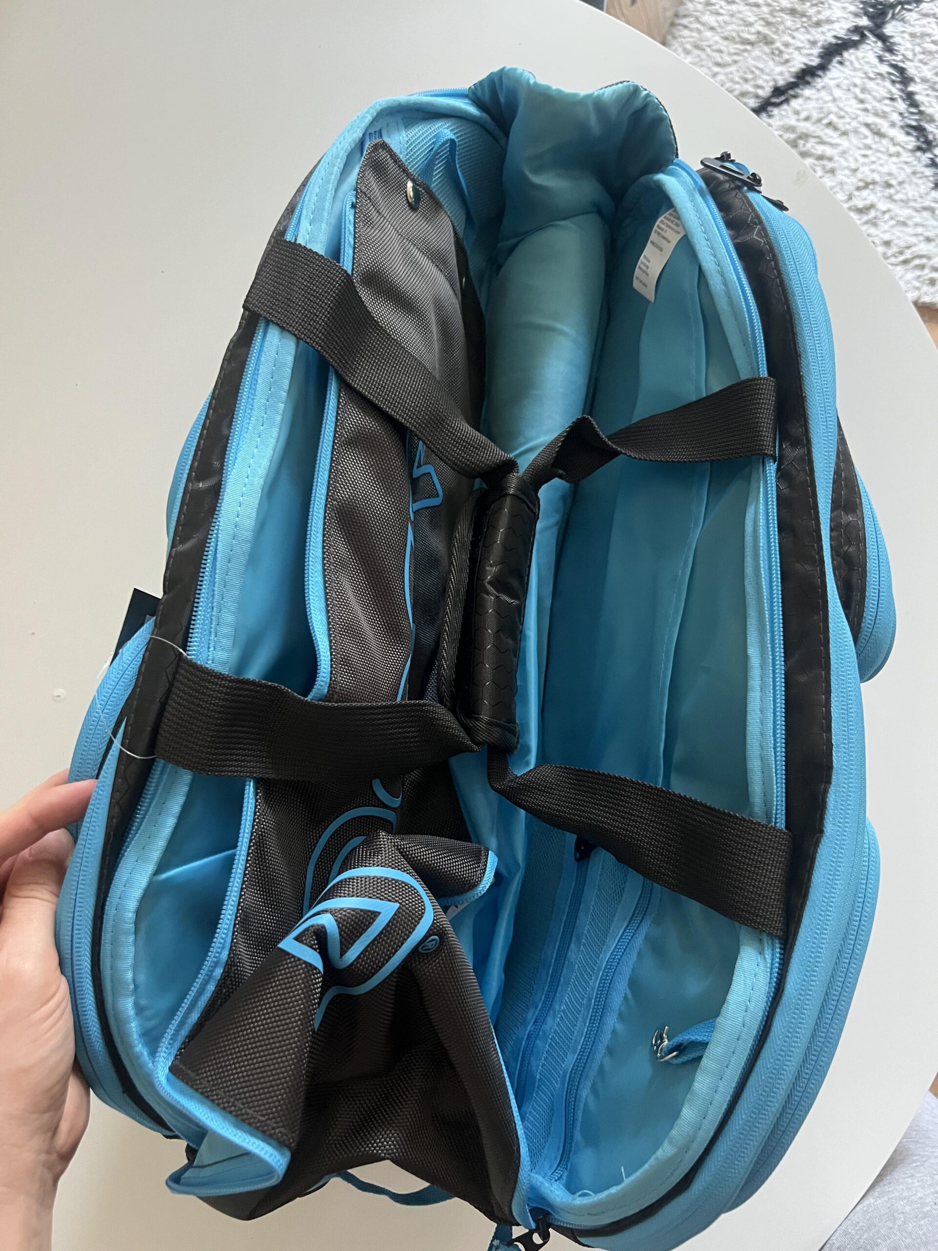 JOOLA Tour Elite black light blue bag showing duffle handles and carry straps