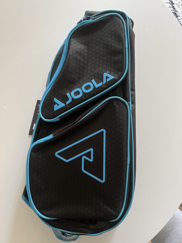 Original overhead photo of JOOLA Tour Elite pickleball bag in black with light blue trim