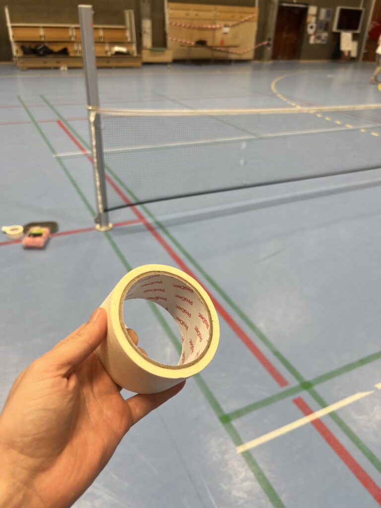 ProDec 50mm masking tape used for a temporary pickleball Kitchen line on an indoor badminton court