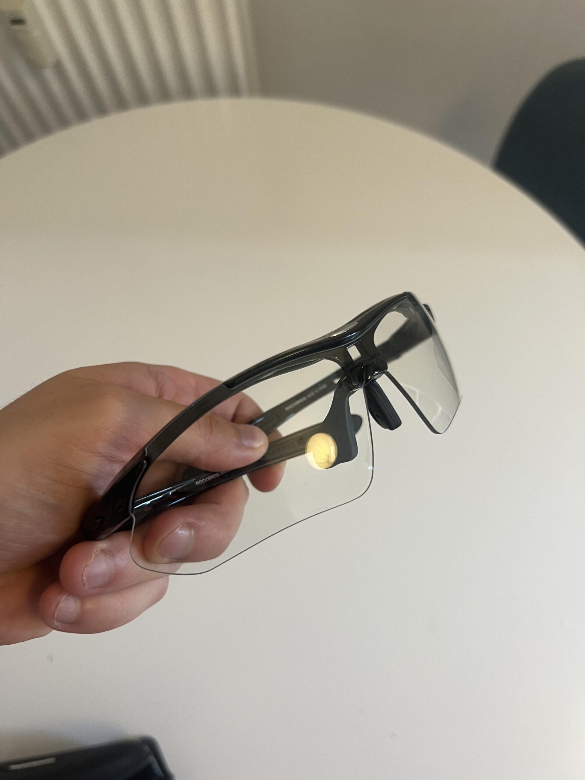 ROCKBROS photochromic pickleball glasses frame and clear lens close-up