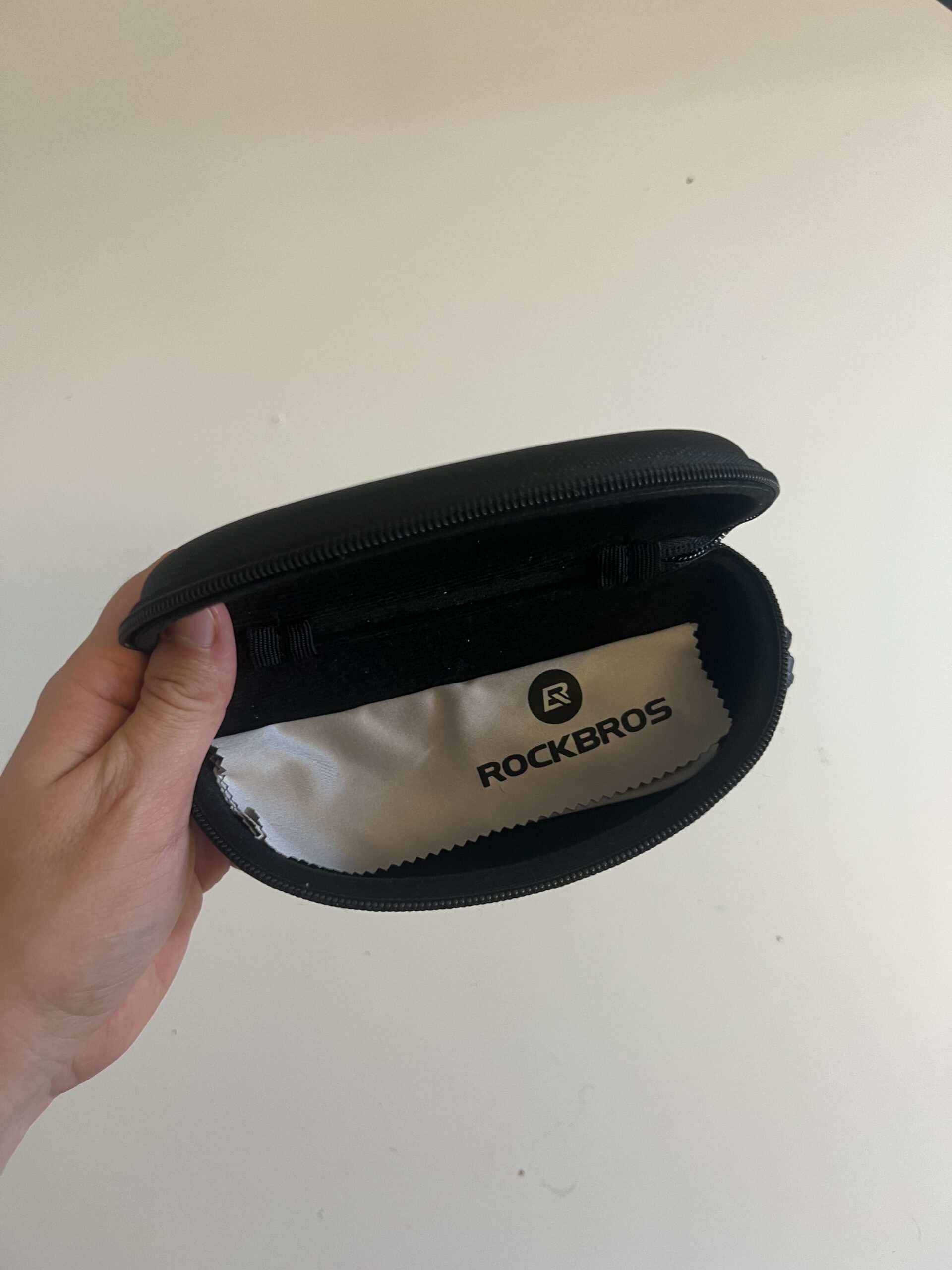 ROCKBROS photochromic pickleball glasses hard case opened with cleaning cloth inside